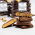 Stack of chocolate-covered candy bars with a blurred background