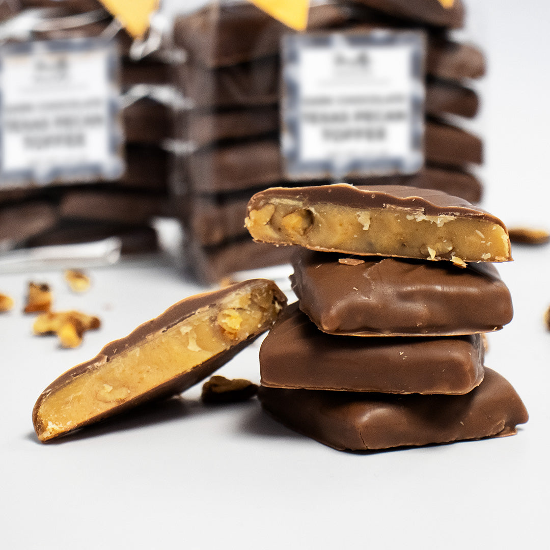 Stack of chocolate-covered candy bars with a blurred background