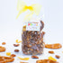 Packaged snack mix with a yellow bow and 'Chocolate Pizazz' label on a white background