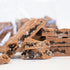 Chocolate bars with cookie pieces on a white background