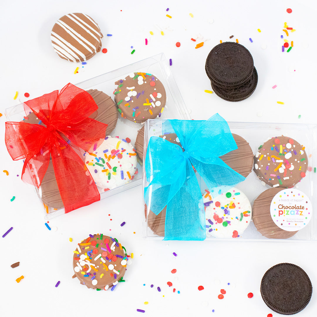 Assorted cookies with colorful sprinkles and bows on a white background