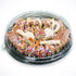 Plastic container with pretzels and colorful sprinkles on a white background