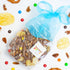 Packaged snack mix with a blue ribbon on a white background with scattered snacks.