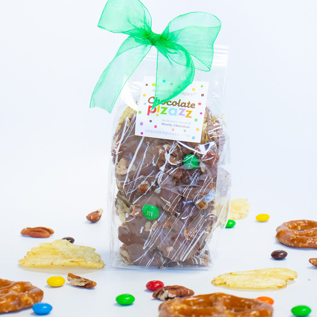 Bag of chocolate covered pretzels with a green bow and 'Chocolate Fizzazz' label on a white background.